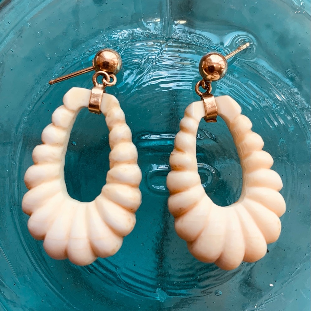 Vintage 80’s natural bone pierced earrings with gold metal details.